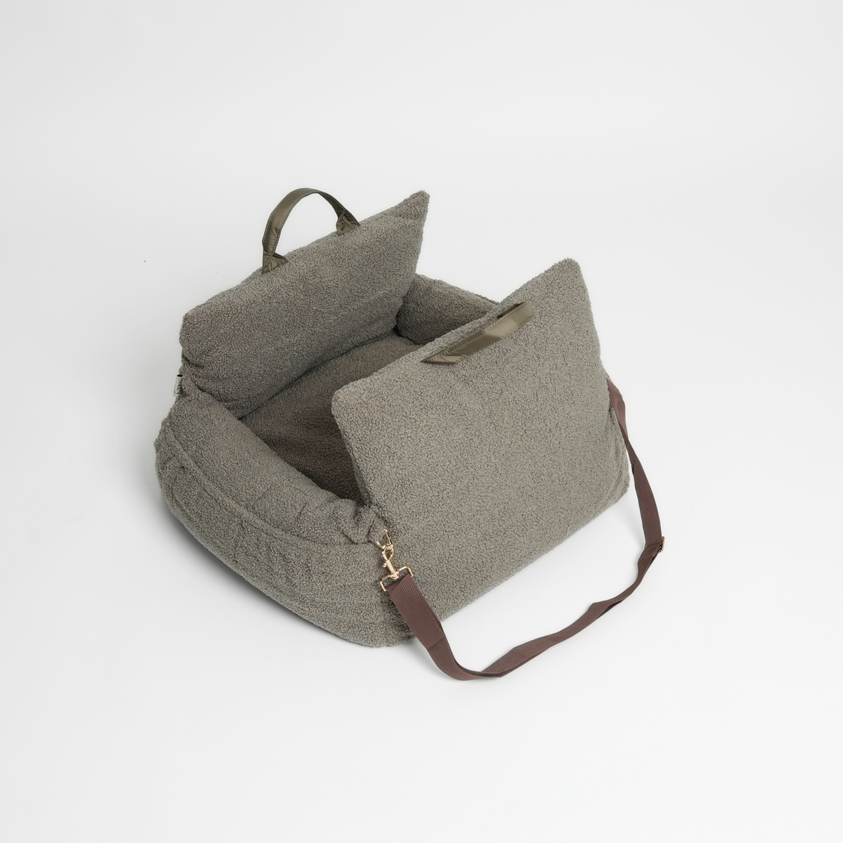 Green textured bag with a strap on a light gray background