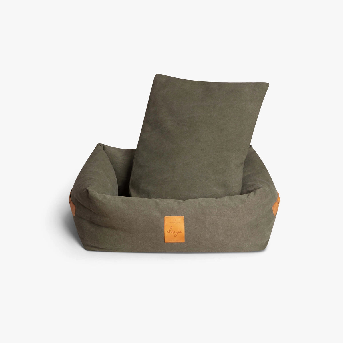 Green pet bed with a pillow on a white background