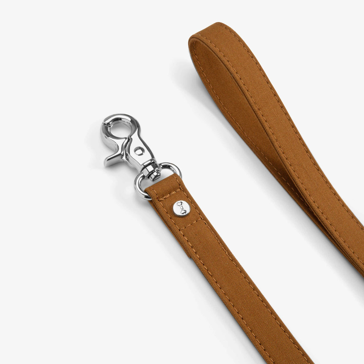 Brown dog leash with silver clasp on a white background