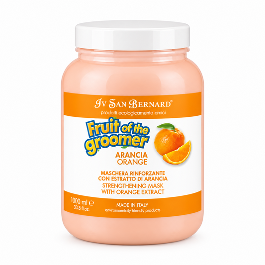 A 1000 ml plastic jar of Iv San Bernard Fruit of the Groomer Strengthening Mask with Orange Extract, featuring a peach-colored body, a white cap, and an orange and white label.