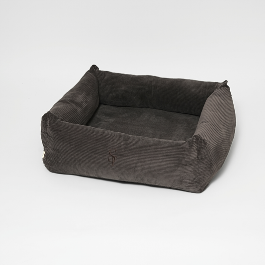 Gray corduroy pet bed on a white background