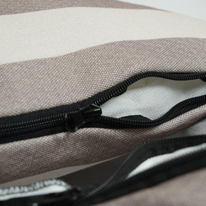Close-up of a striped fabric bag with a black zipper.