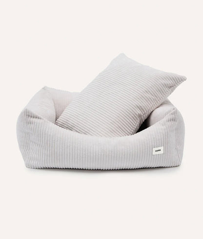 Gray bean bag chair with a pillow on a white background