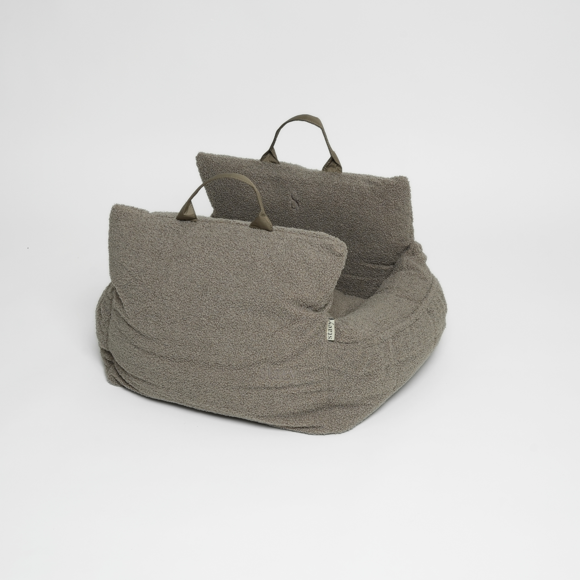 Gray textured bean bag chair with two cushions on a white background
