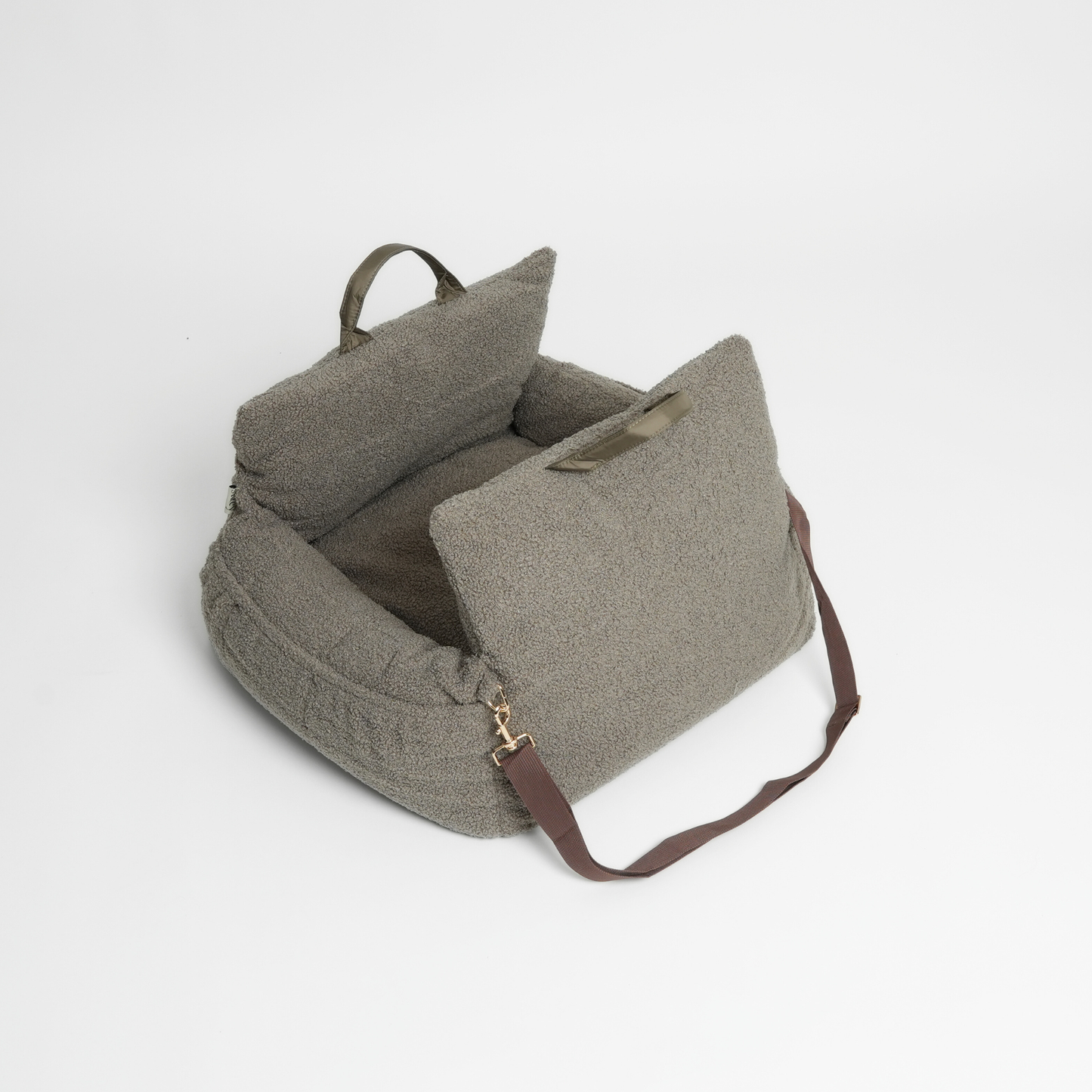 Green textured bag with a strap on a light gray background
