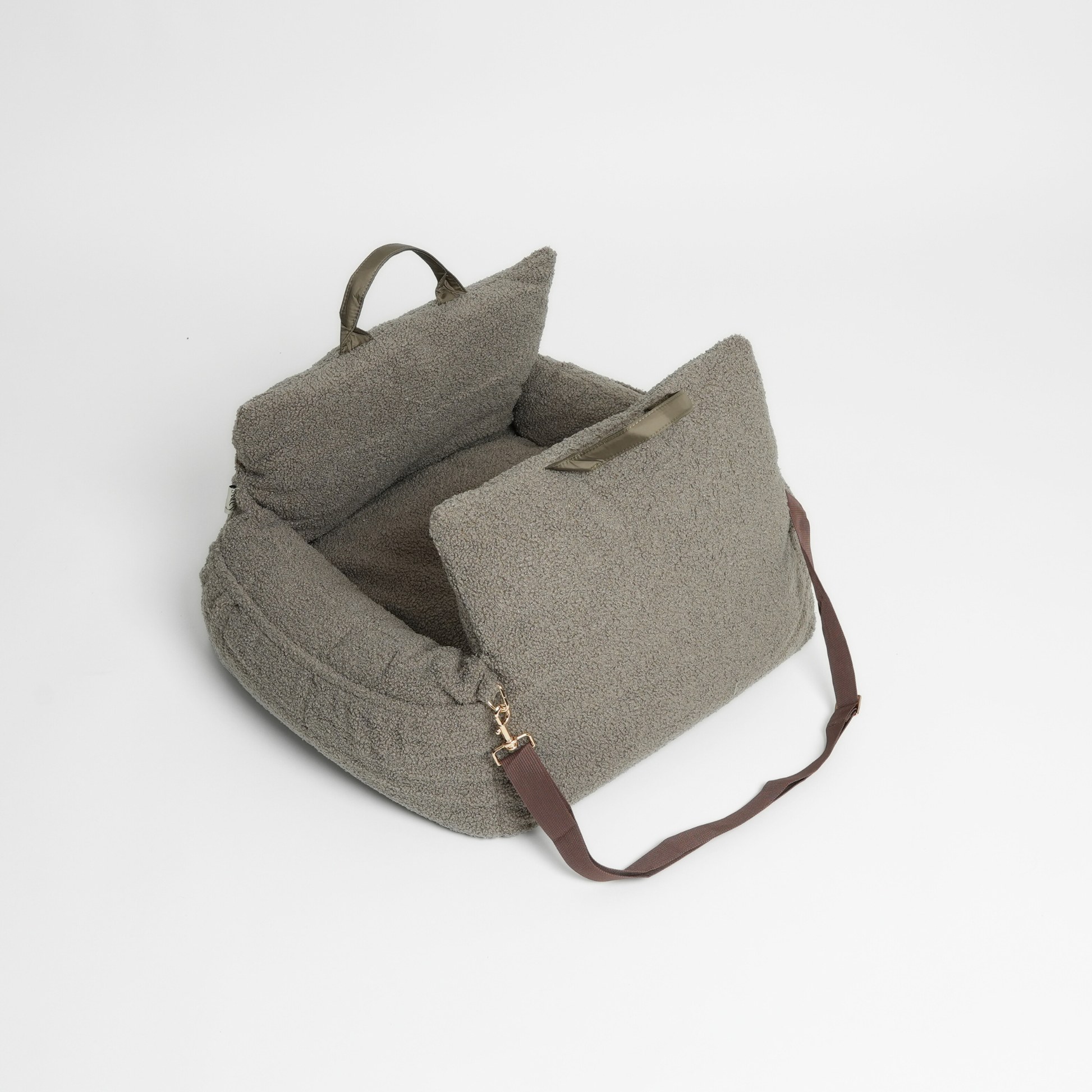 Green textured bag with a strap on a light gray background