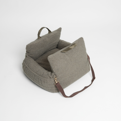 Green textured bag with a strap on a light gray background
