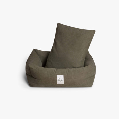 Brown pet bed with a pillow on a white background