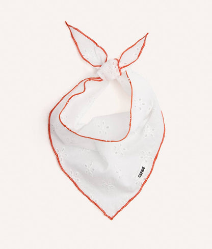 White bandana for dogs with orange trim on a white background