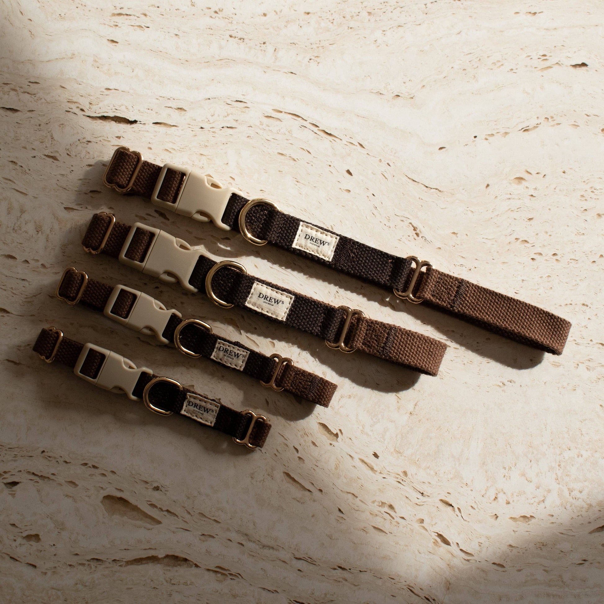 Set of dog collars with visible brand label on a textured surface