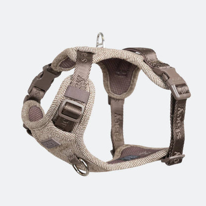 Dog harness with brown and gray straps on a white background