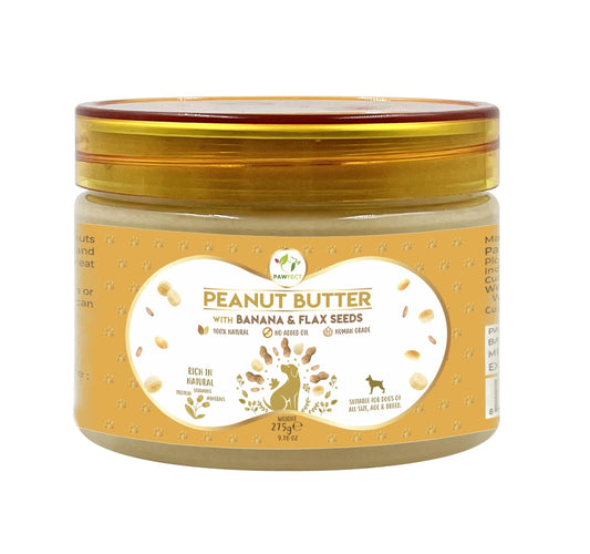 Jar of peanut butter with banana and flax seeds on a white background