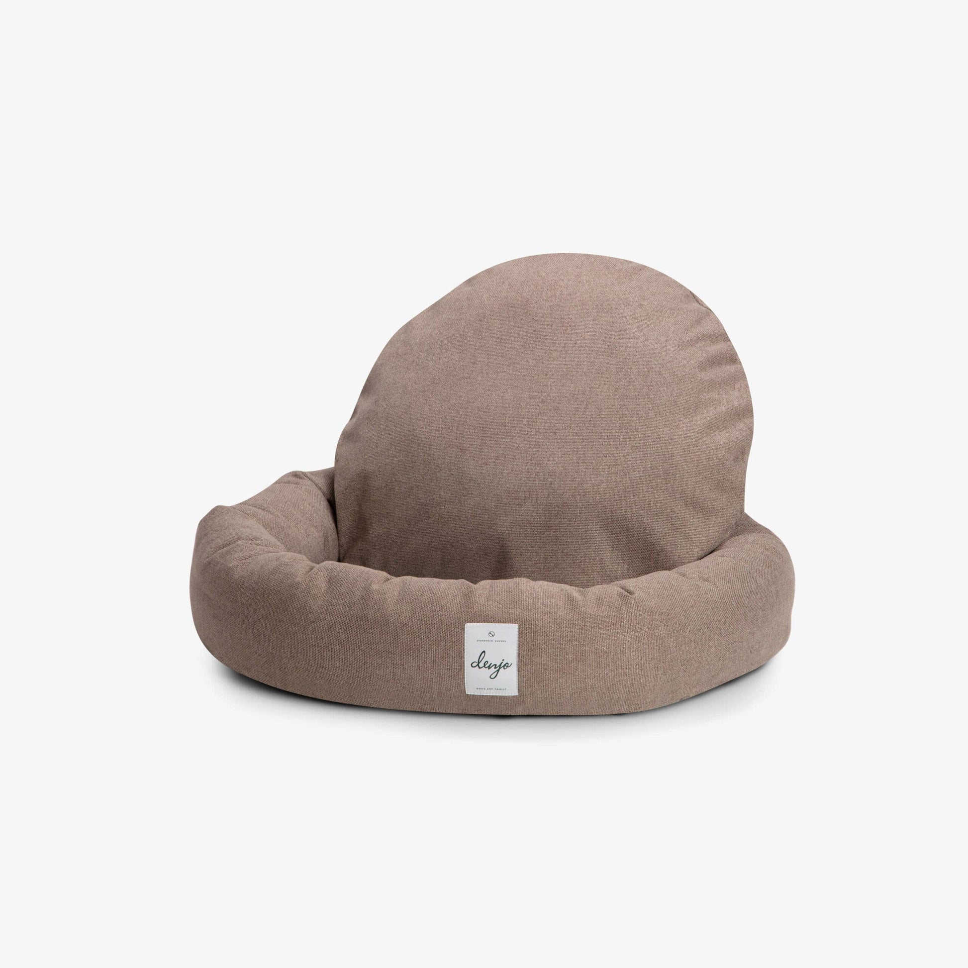 Brown pet bed with a label on a white background