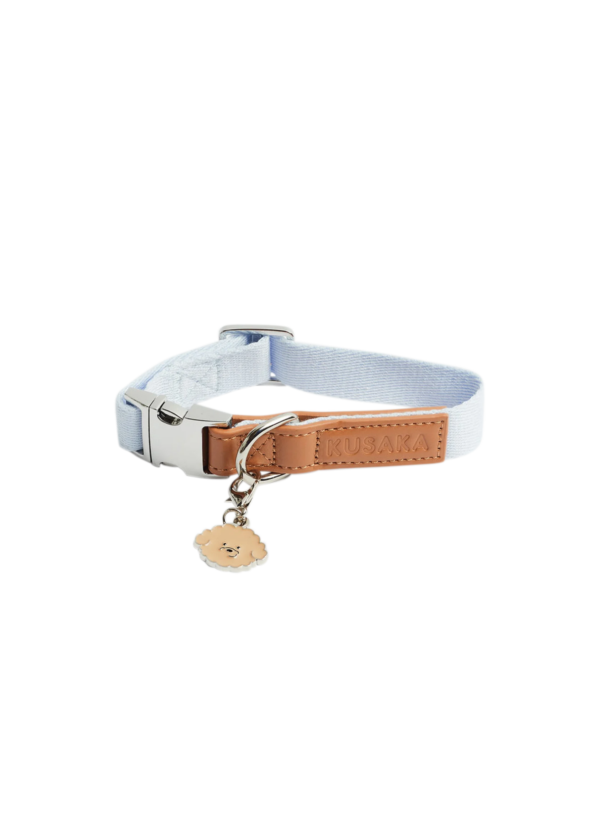 A light blue nylon pet collar strap with a brown leather accent panel, silver metal hardware, and a small hanging bone-shaped tag.