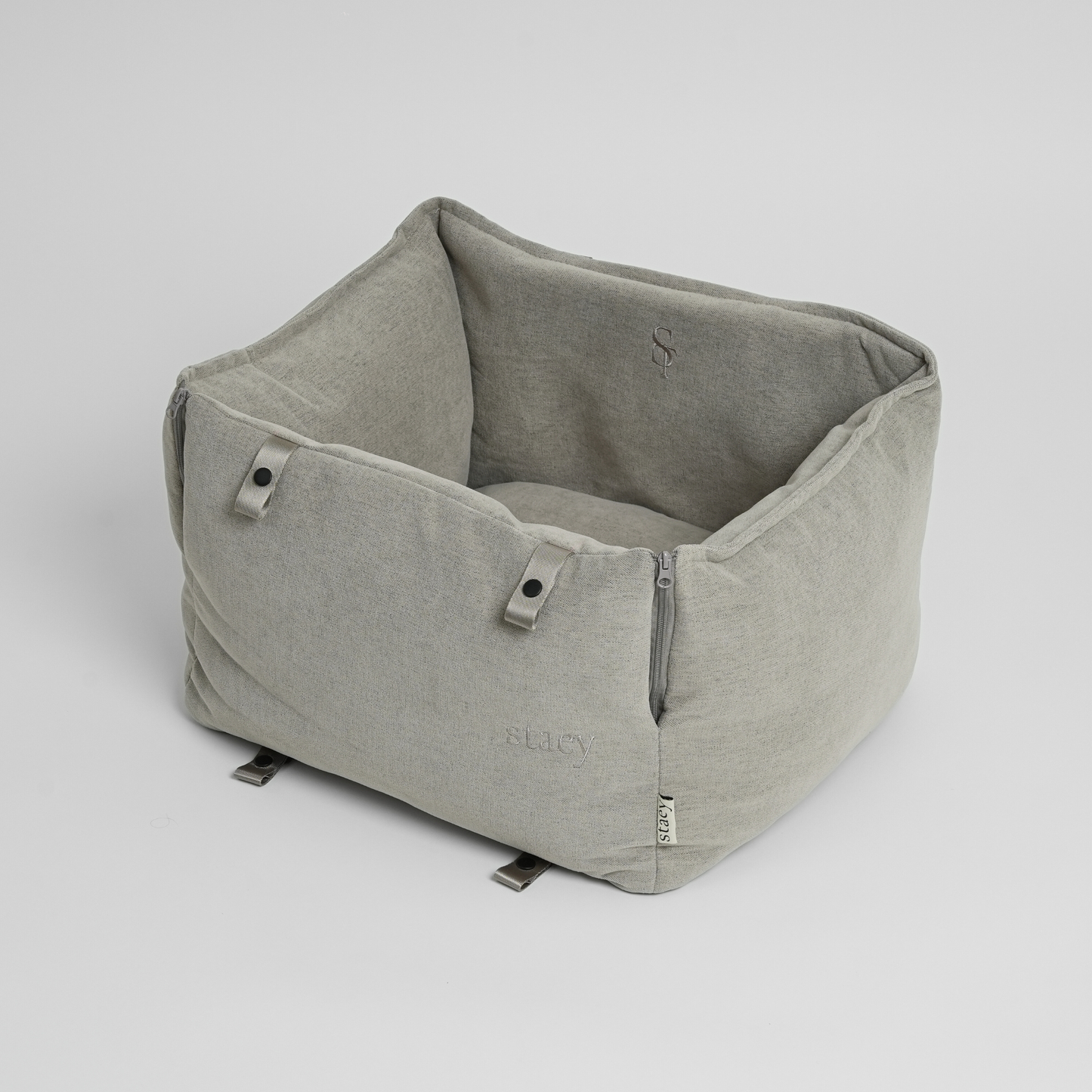 Gray fabric pet bed on a light gray background