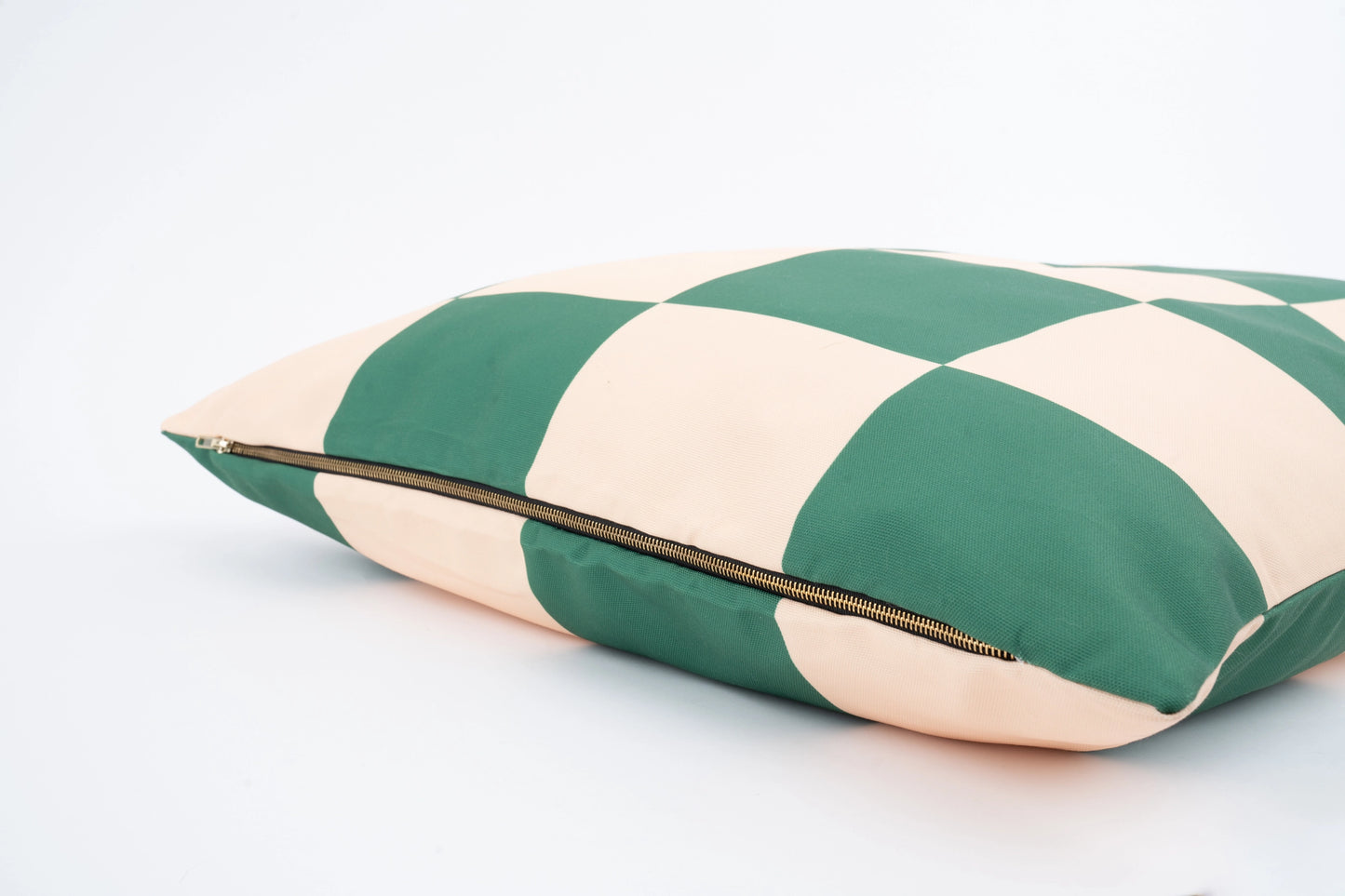 Green and beige striped pillow with a zipper on a white background