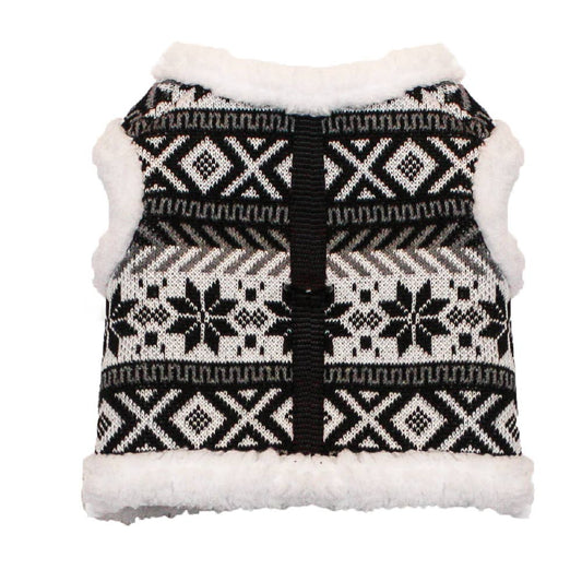 Black and white patterned dog sweater with white trim on a white background