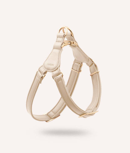 Beige dog harness on a white background