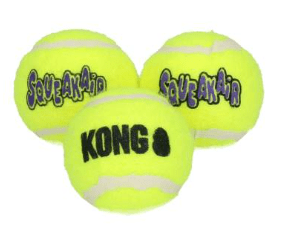 Three yellow KONG brand tennis balls on a white background