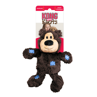Brown plush toy with blue paw pads on a white background