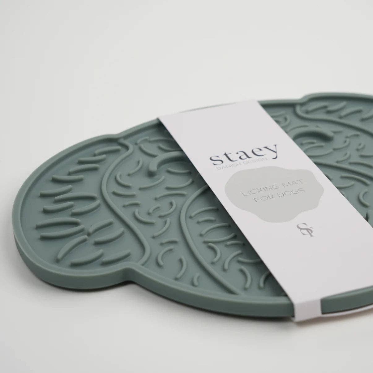 Green dog mat with 'Staey' branding on a white background