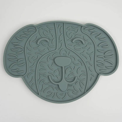 Green silicone mat with a lion design on a white background