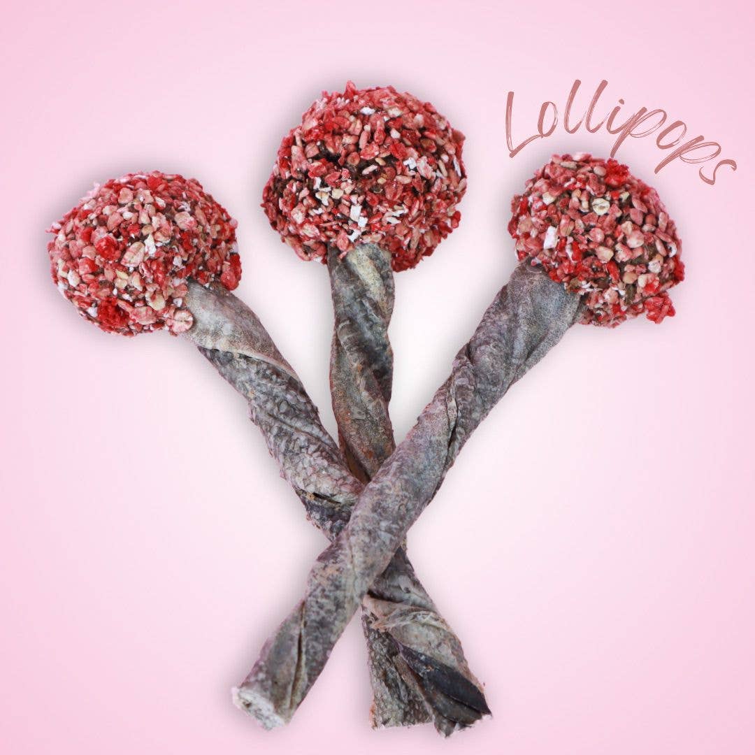 Three decorative lollipops with glittery red balls on a pink background, labeled 'Lollipops'.