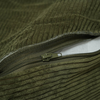 Close-up of a green textured fabric with a zipper