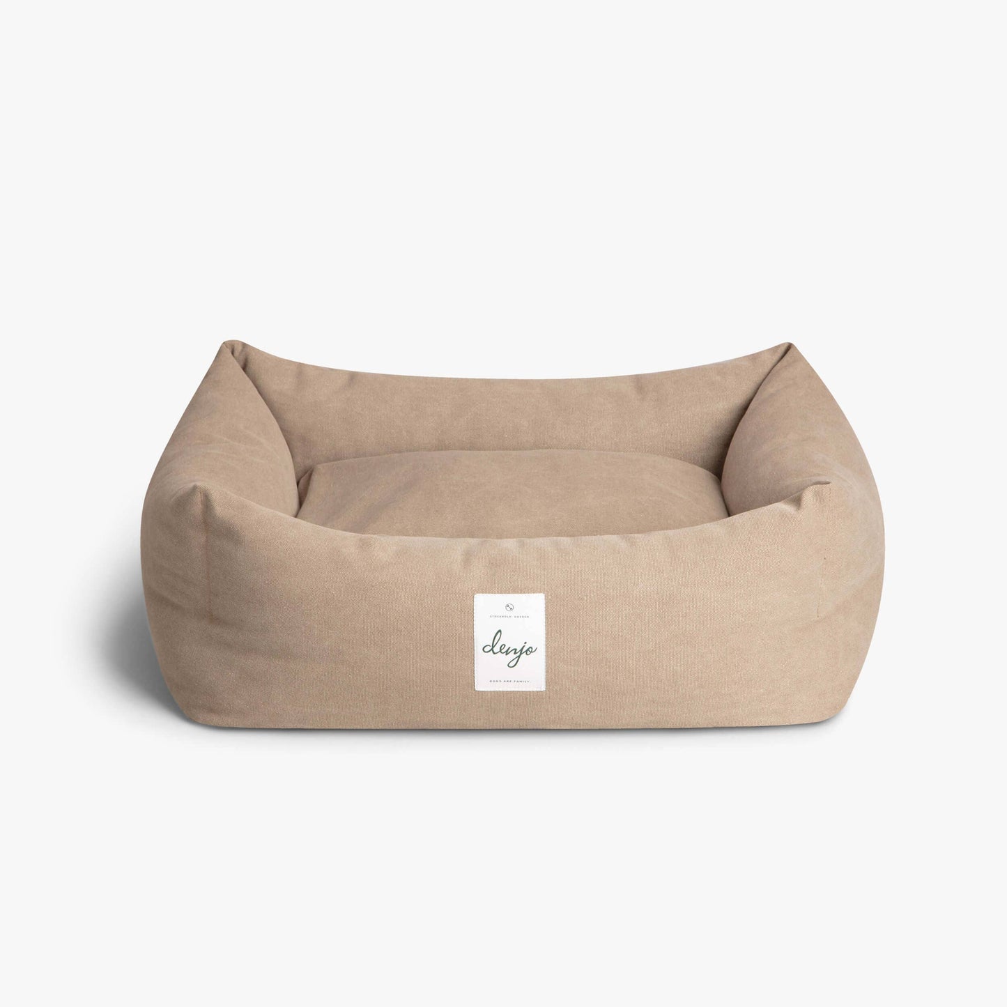 Beige pet bed with a visible brand label on a white background