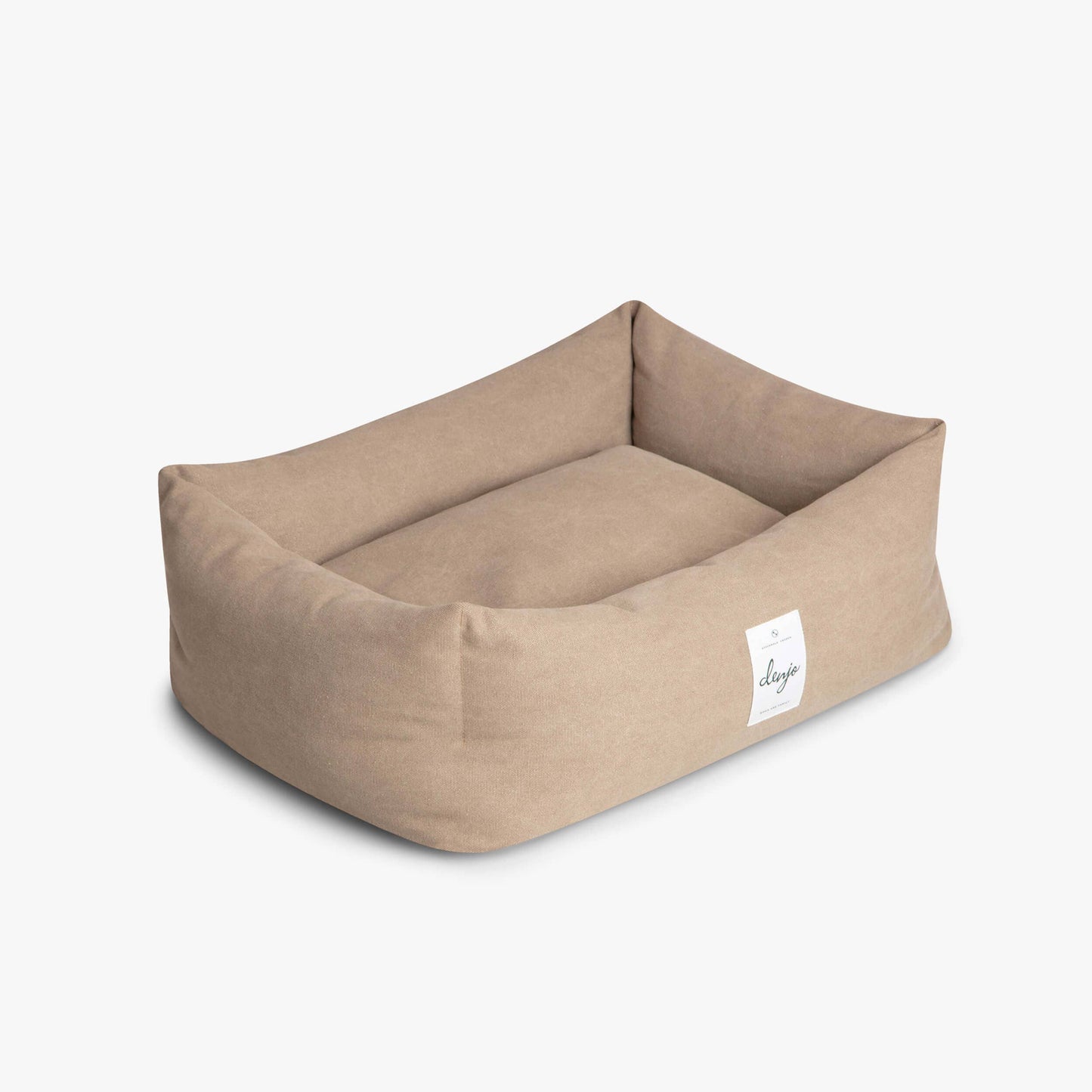 Beige pet bed with a visible brand label on a white background