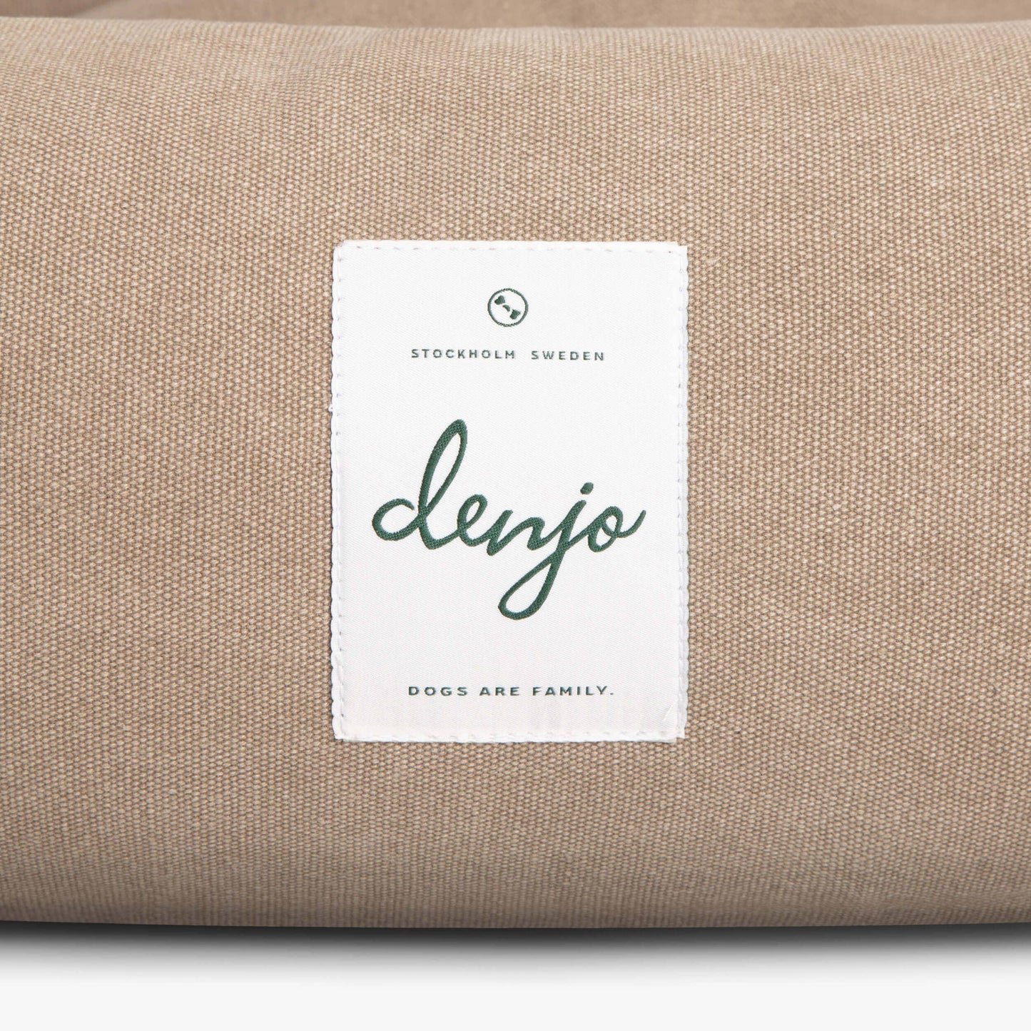 Beige fabric with a 'denjo' label on a white background
