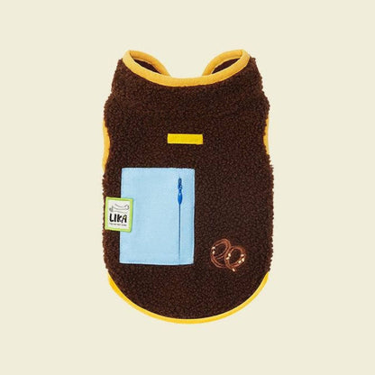 Brown pet coat with yellow trim and a blue pocket on a beige background, featuring the Lika brand.