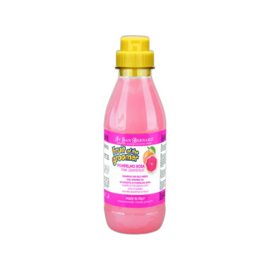 Pink bottle with yellow cap on a white background