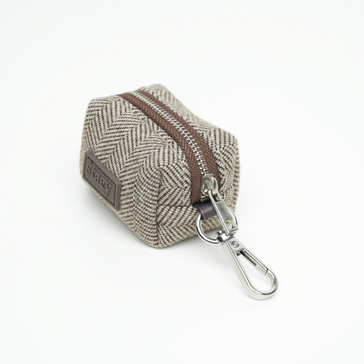 Hexagonal pouch with zipper and keychain attachment on a white background