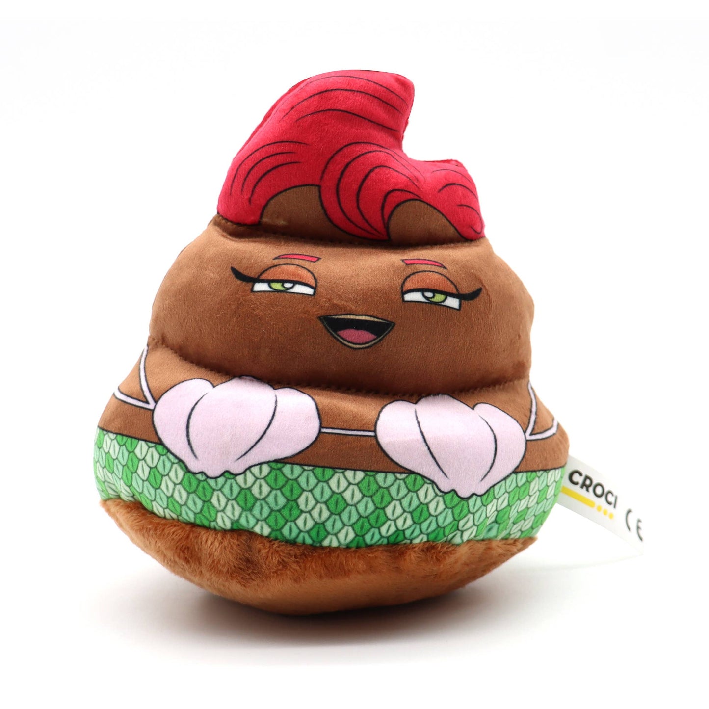 Plush toy resembling a cartoonish poop emoji with a red hat and green patterned skirt on a white background.
