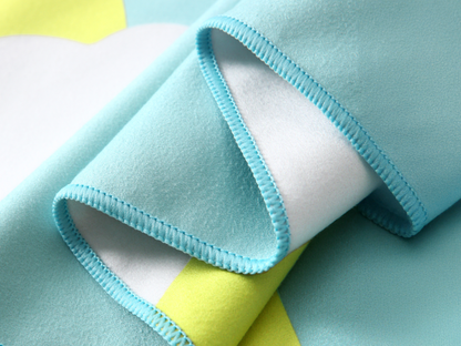 Close-up of blue and yellow fabric with a textured edge