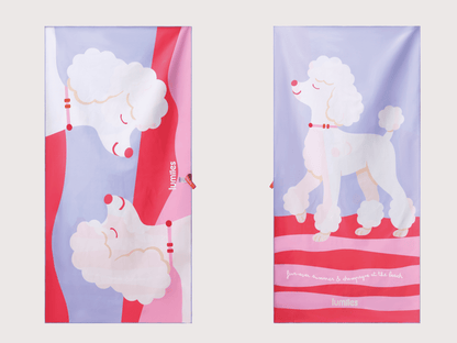 Two towels with poodle designs on a light purple background