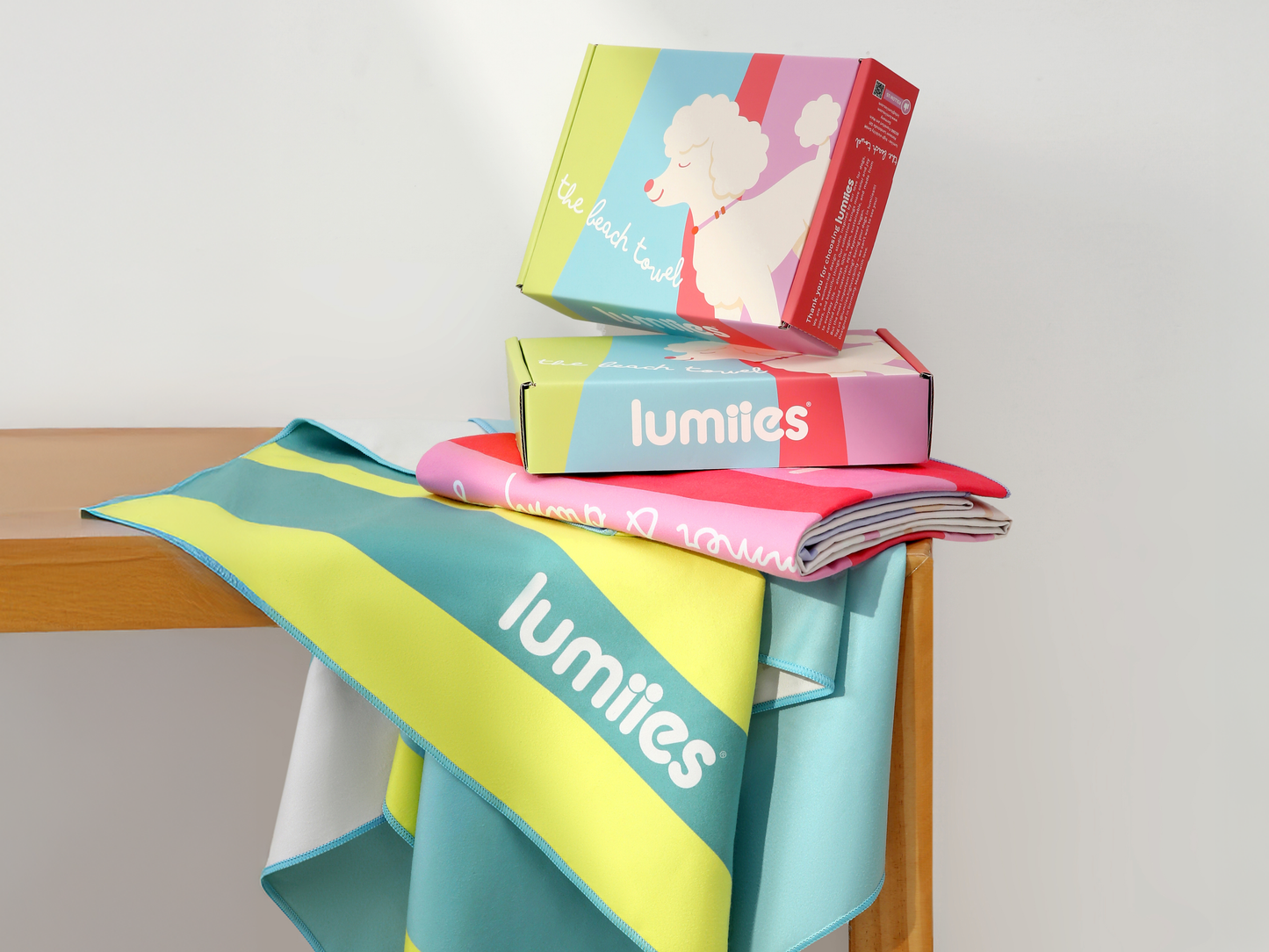 Colorful Lumilites products on a wooden surface with a white background