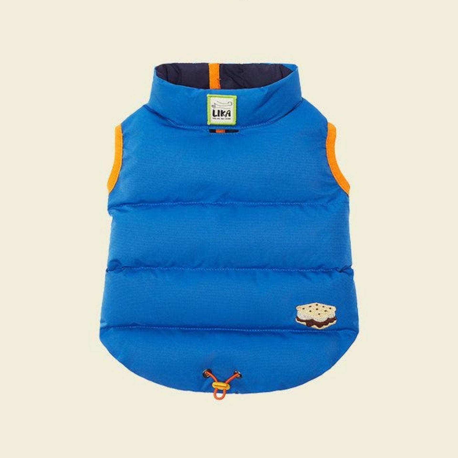 Blue puffer dog vest with orange accents on a beige background, featuring the Lika brand.