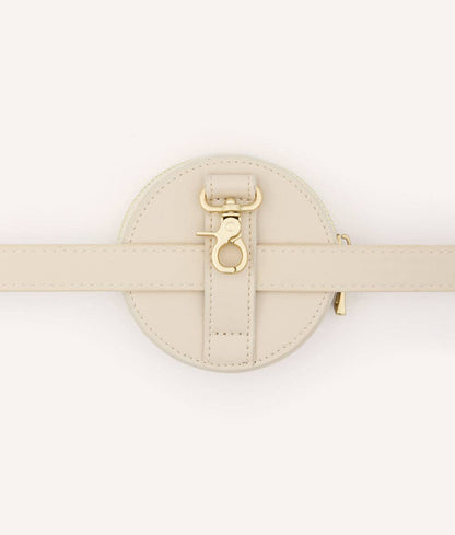 Beige round belt treat bag with gold buckle on a white background