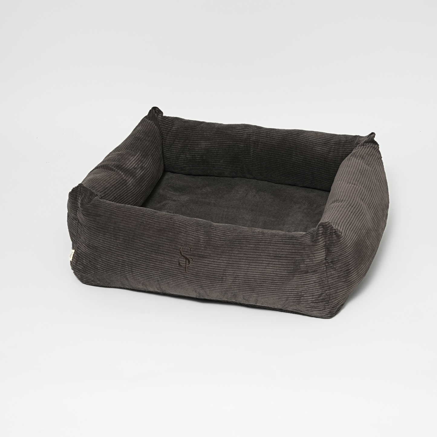 Gray corduroy pet bed on a white background