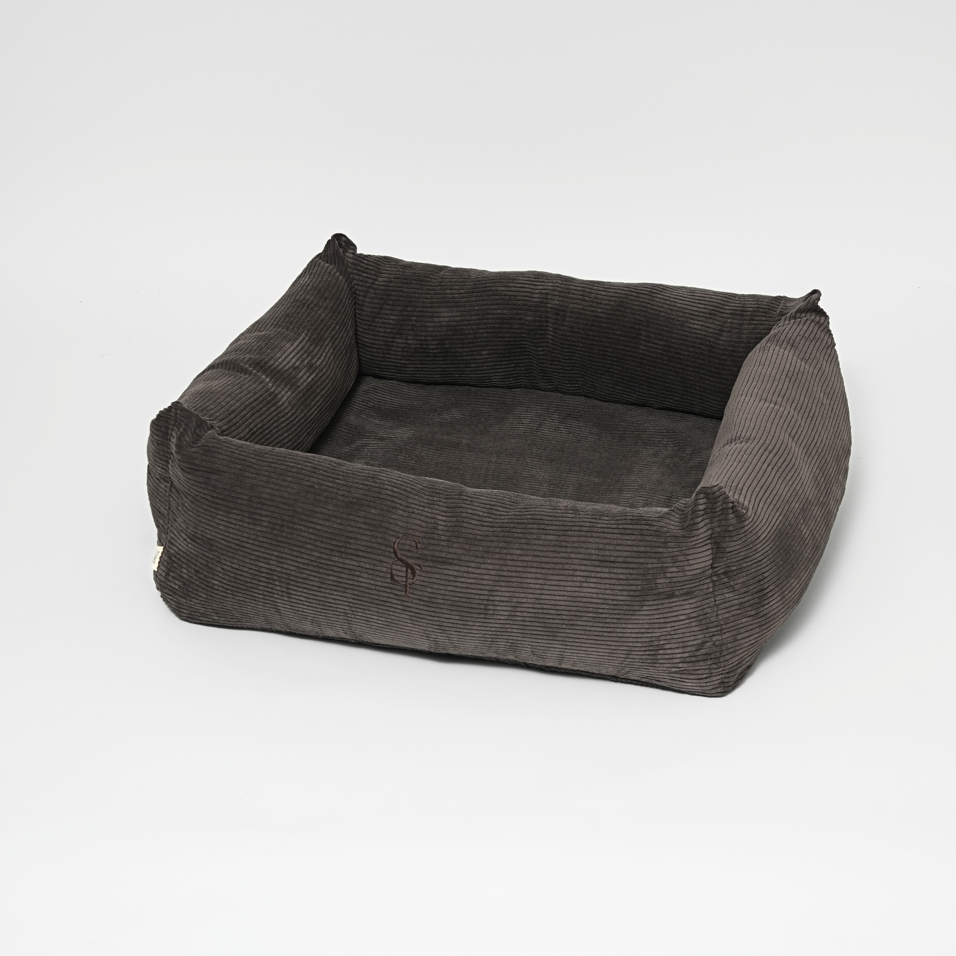 Gray corduroy pet bed on a white background