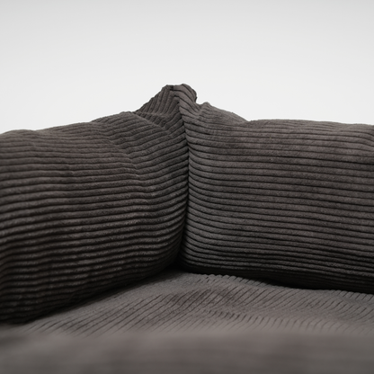 Gray corduroy fabric on a plain background