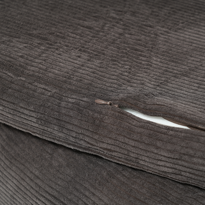 Close-up of a brown corduroy fabric with a zipper