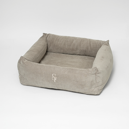 Gray pet bed with a logo on a white background